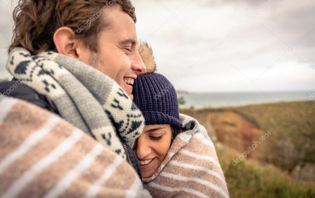 depositphotos_61852705-stock-photo-young-couple-laughing-outdoors-under